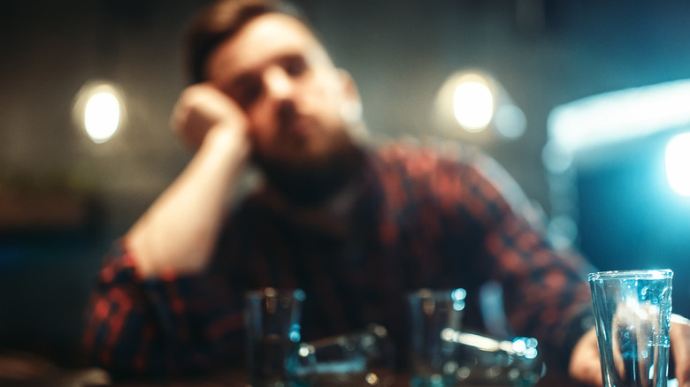drunk man blurred in background