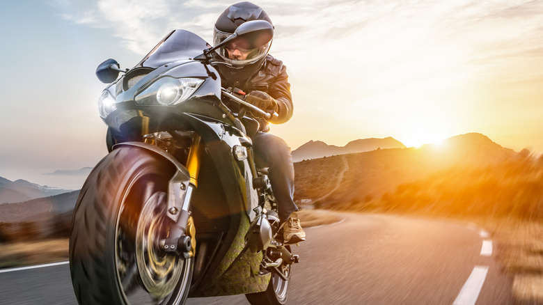 man on motorcycle on highway 