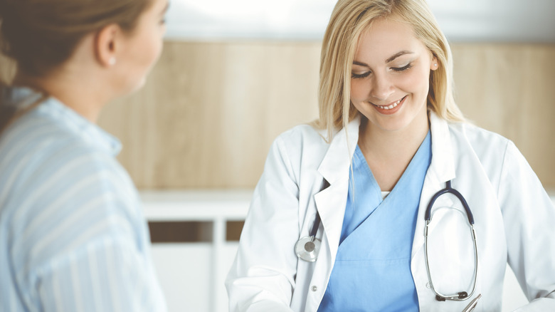 woman talking to doctor