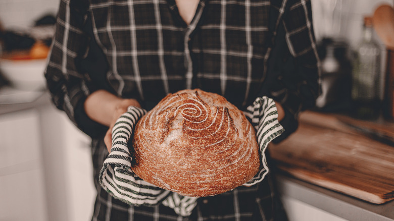 woman holding bread