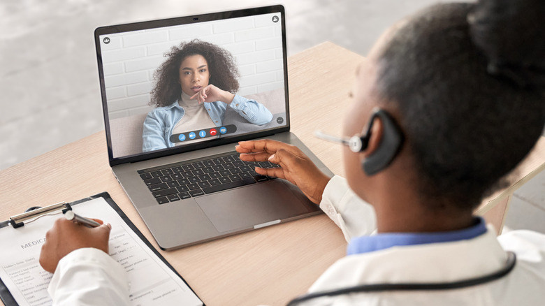 female doctor talking over zoom