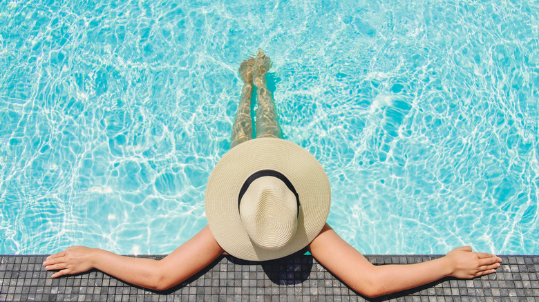 woman sunbathing at pool