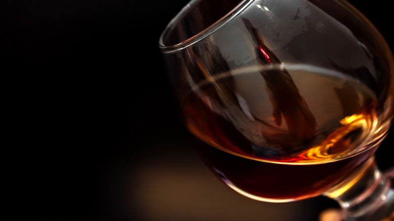 glass of whisky with black background