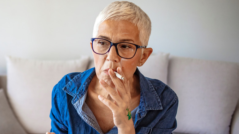 elderly woman smoking