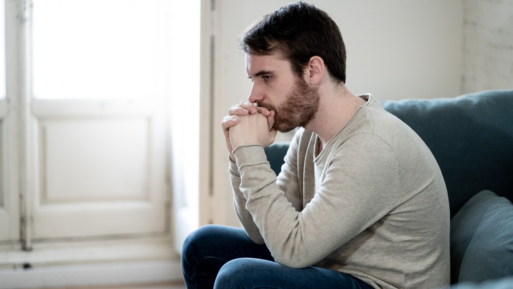 worried man alone in room