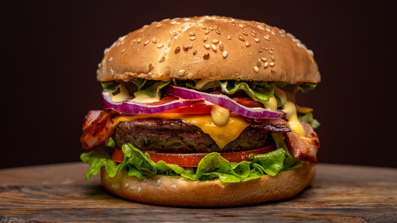 classic burger on wooden board