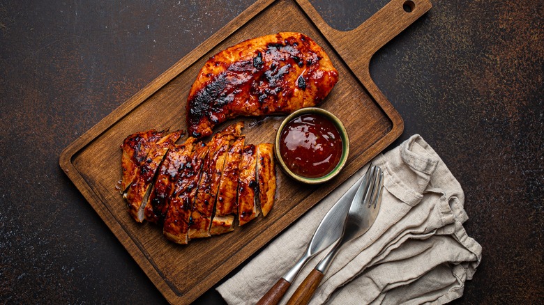 grilled chicken breast on board