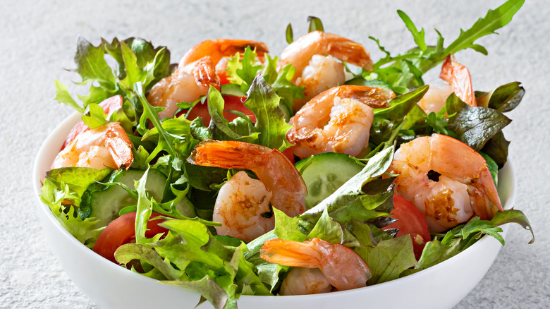 grilled shrimp on lettuce in bowl