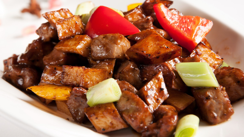 beef and red peppers on plate