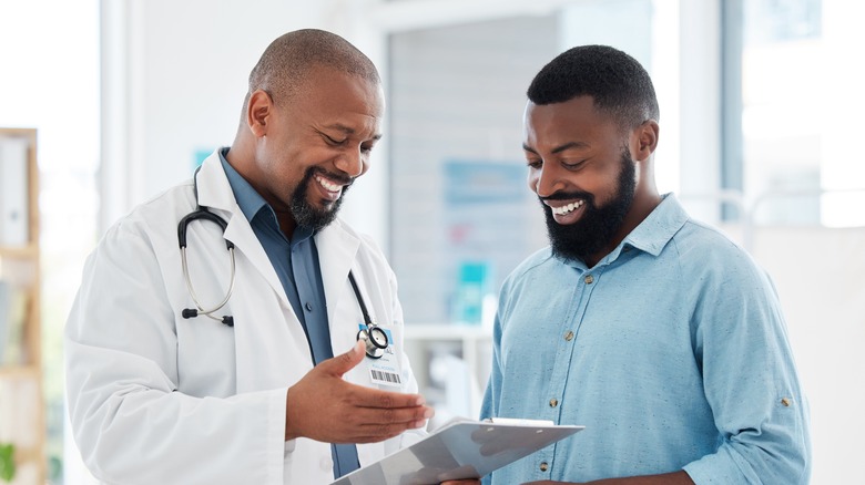 doctor explaining testosterone benefits to male patient