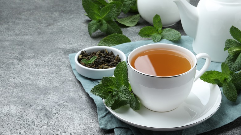 Cup of mint tea on a stone table