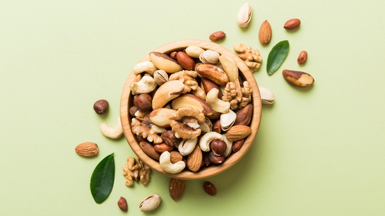 Mixed nuts on wooden bowl