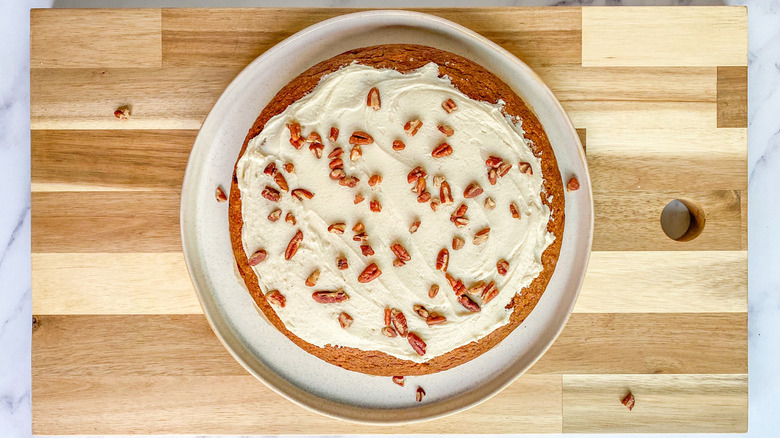 cake topped with pecans