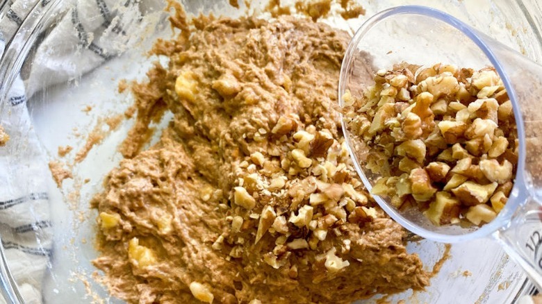adding nuts to banana bread batter