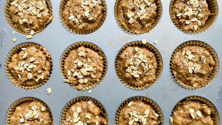 Muffin batter in a lined muffin tin