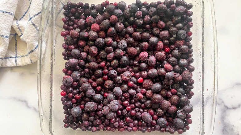 Frozen blueberries in glass baking dish