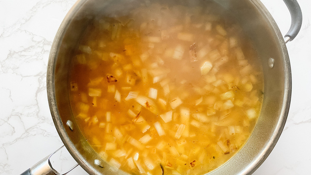 diced onion and rice simmering