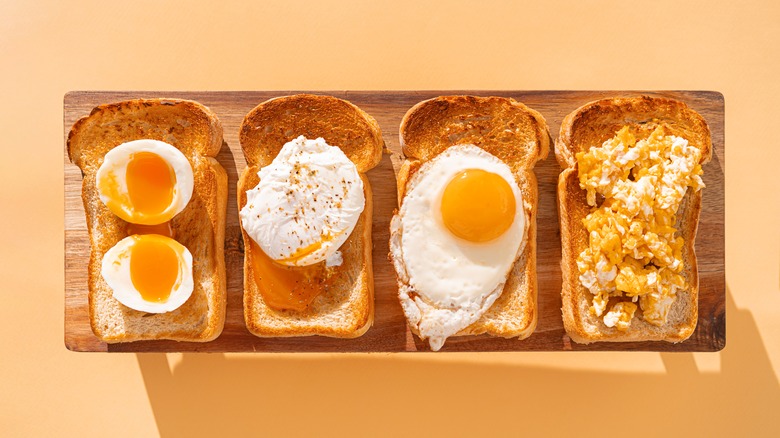 an assortment of different style eggs on toast