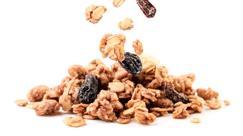 a pile of granola with raisins