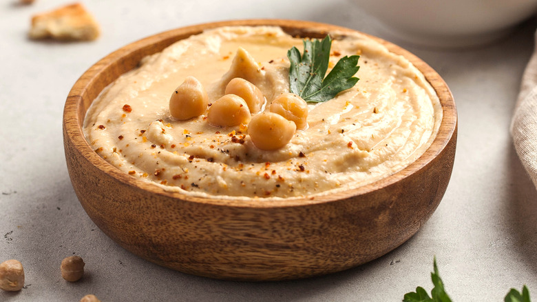 hummus in wooden bowl