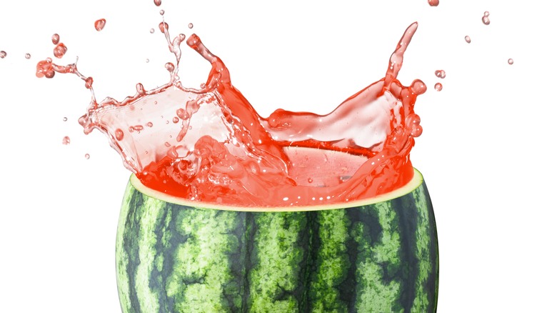 juice splashing from watermelon top