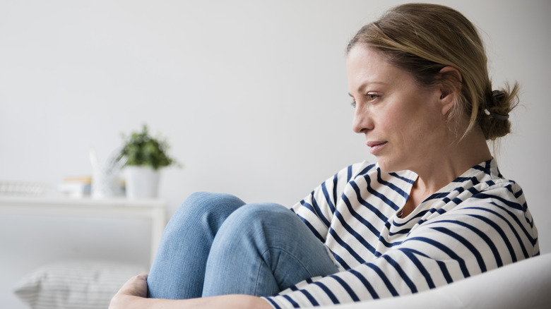 Older woman gazing with stressed look