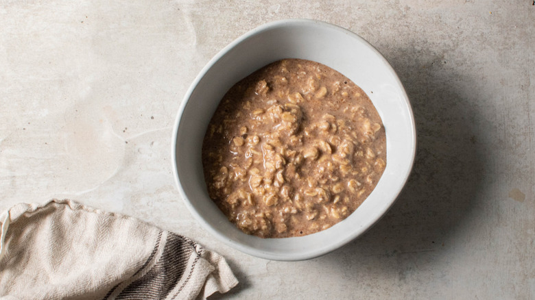 bowl of oatmeal with dishtowel