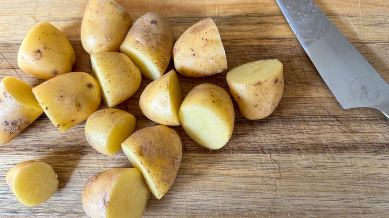 potatoes on cutting board 