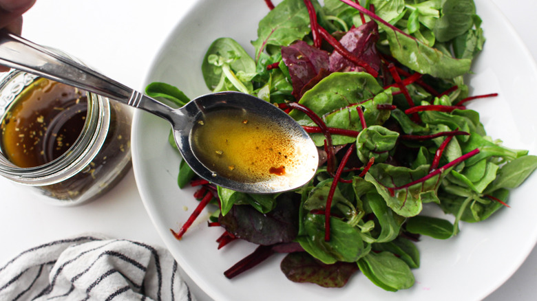spoonful of dressing and greens