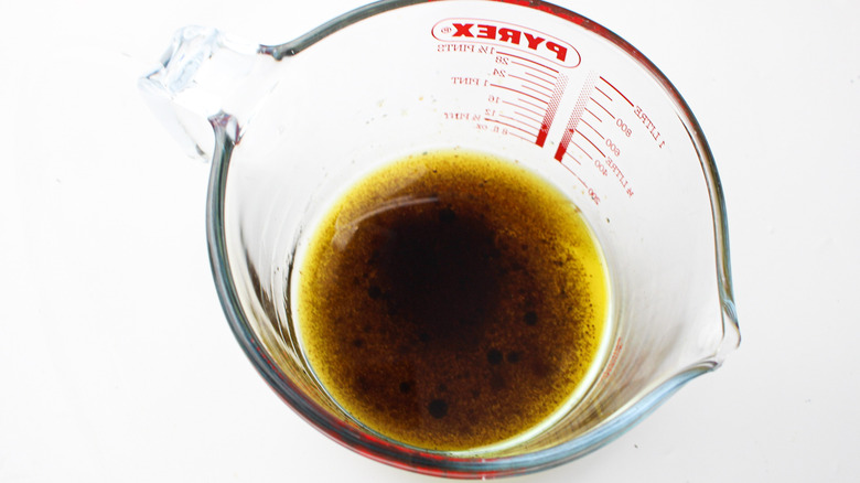 salad dressing in measuring cup