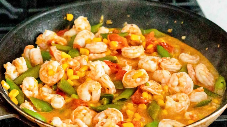 veggies and shrimp in skillet