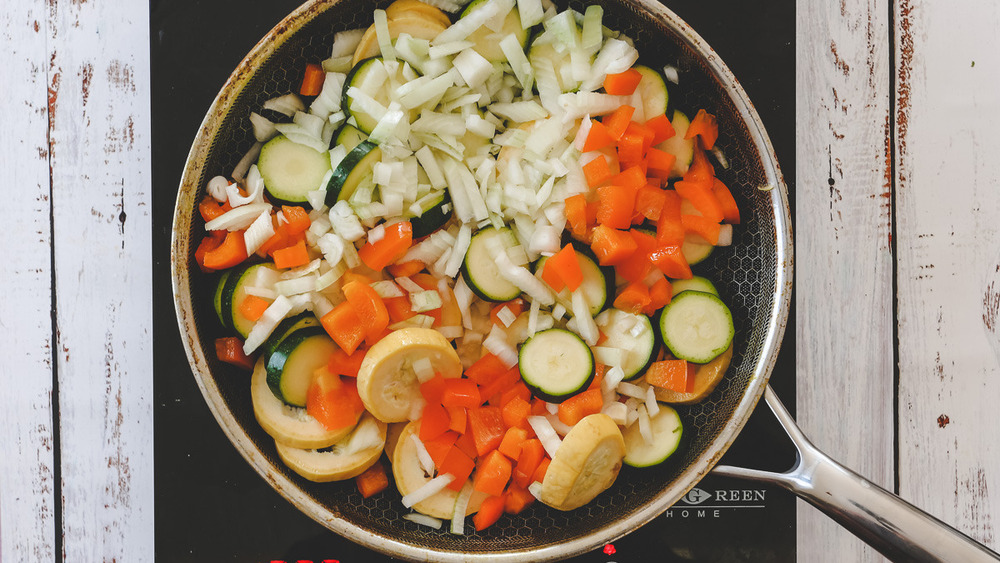 veggies sauteing in pan