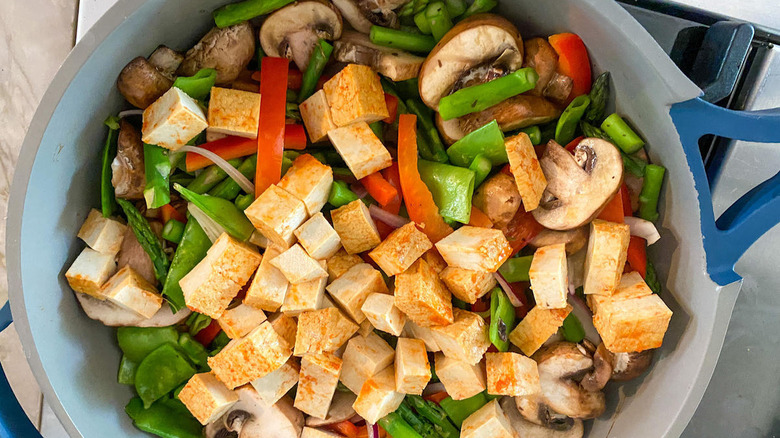 vegetables and tofu in pan