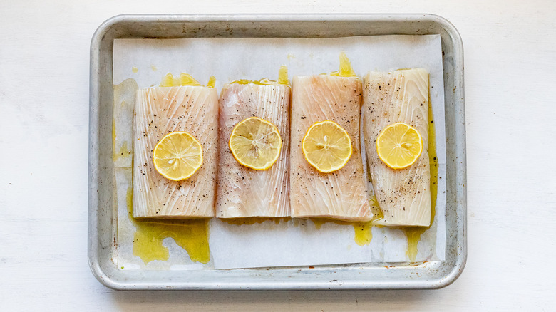 mahi mahi fillets on baking sheet