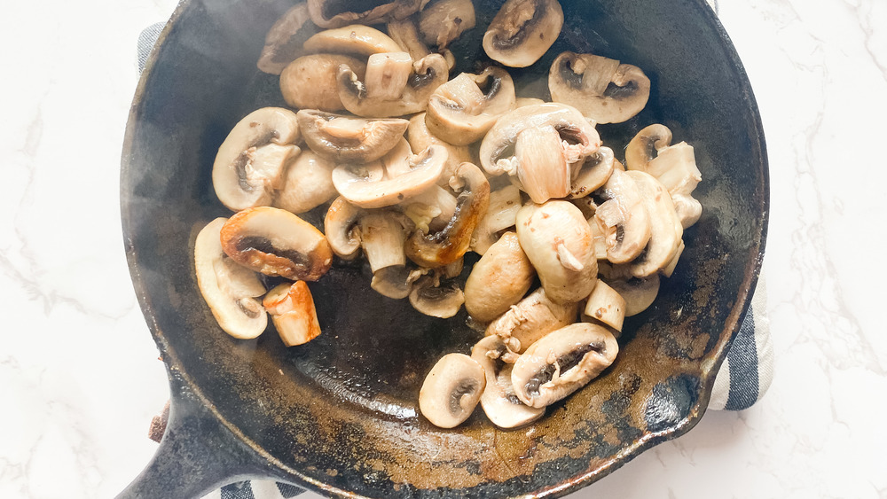 mushrooms cooking for heart-healthy pizza