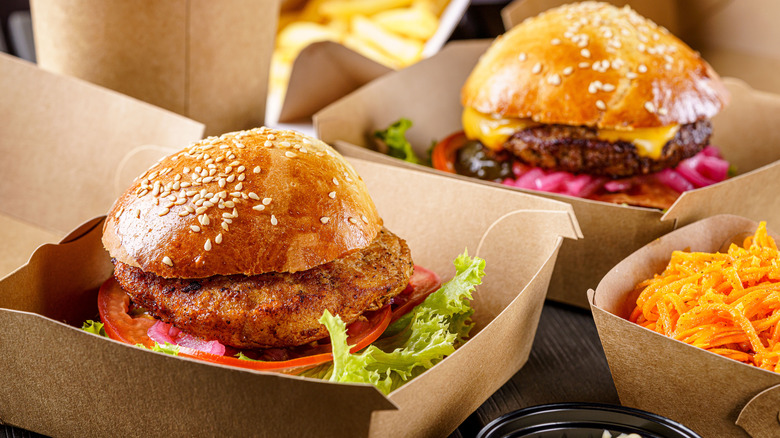 fast food burgers in takeaway cartons