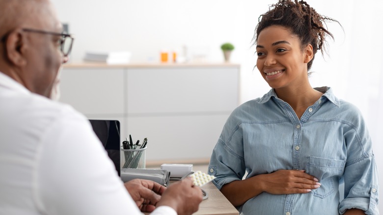 pregnant woman consulting a doctor 