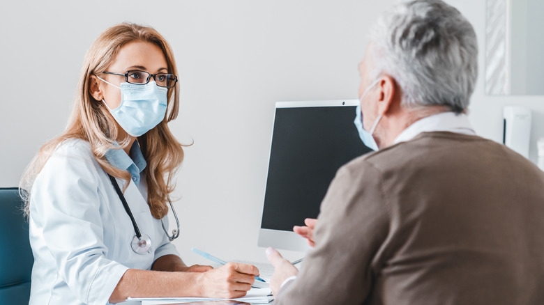 doctor checking up patient