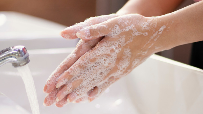 Woman washing hands