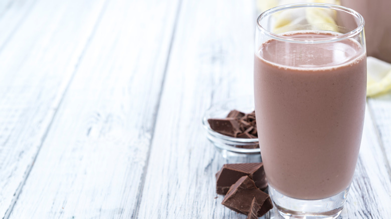 Glass of chocolate milk on a table