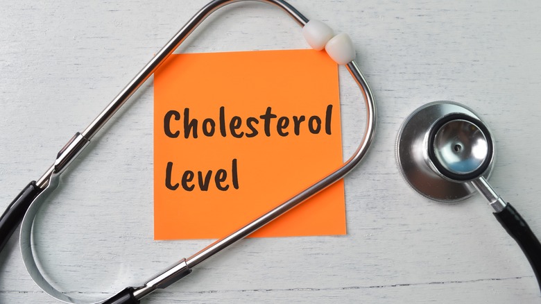 Stethoscope and "cholesterol level" note