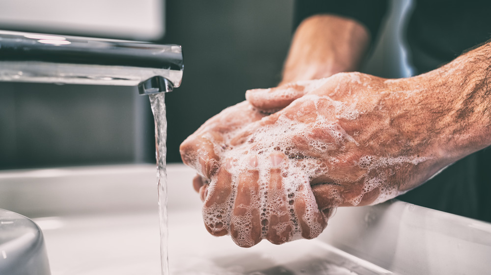 man washing hands