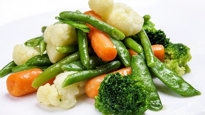 Steamed vegetables on table