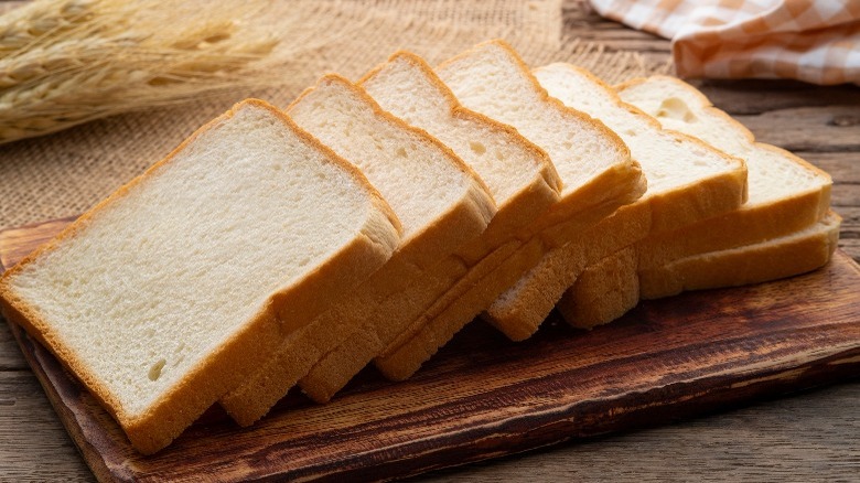 Sliced white bread on table