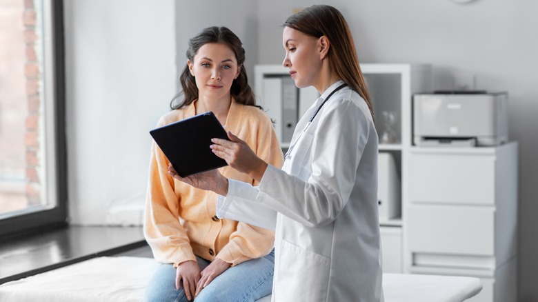 Doctor consulting patient