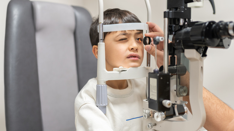 Young boy receiving eye exam