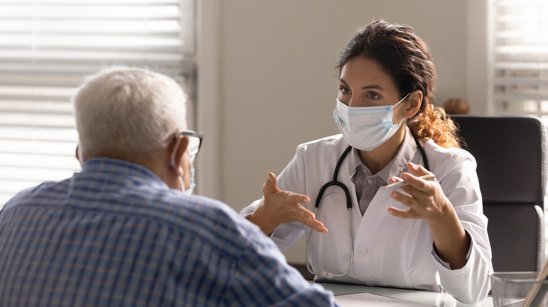 doctor and elderly patient