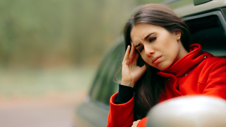 Woman pulled over having motion sickness from car