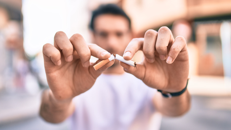 man smoking cigarette