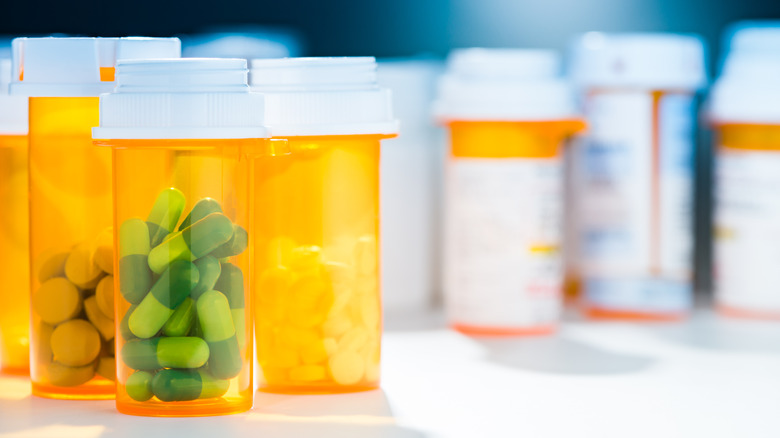 several prescription bottles on table